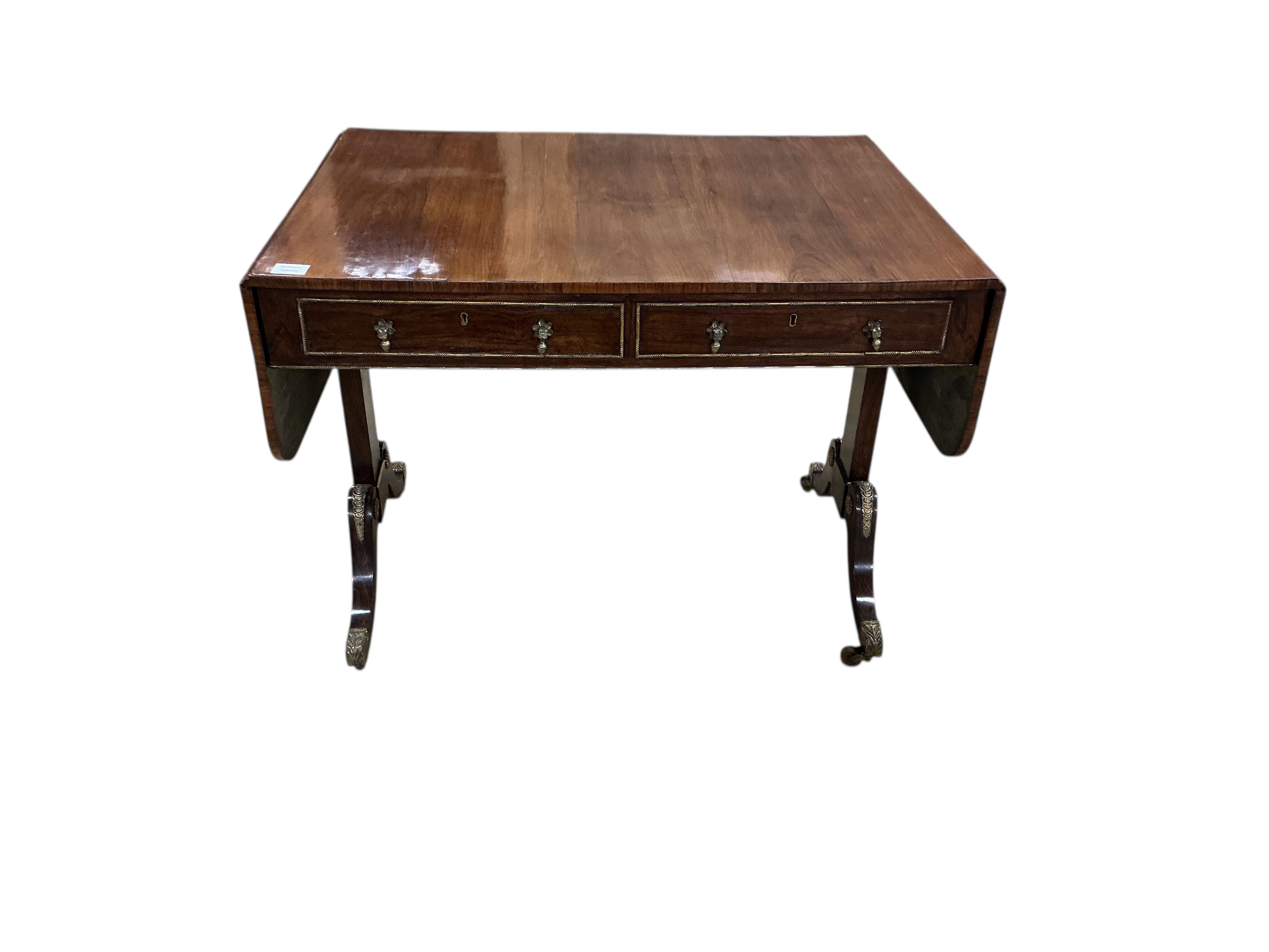 A Regency gilt metal mounted rosewood sofa table, width 94cm, depth 69cm, height 72cm